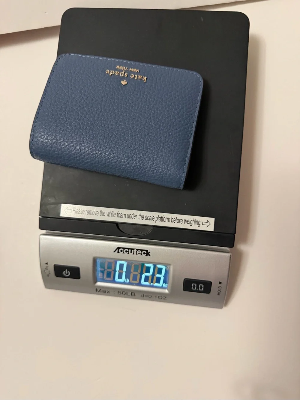 Kate Spade New York blue leather wallet with pebbled texture